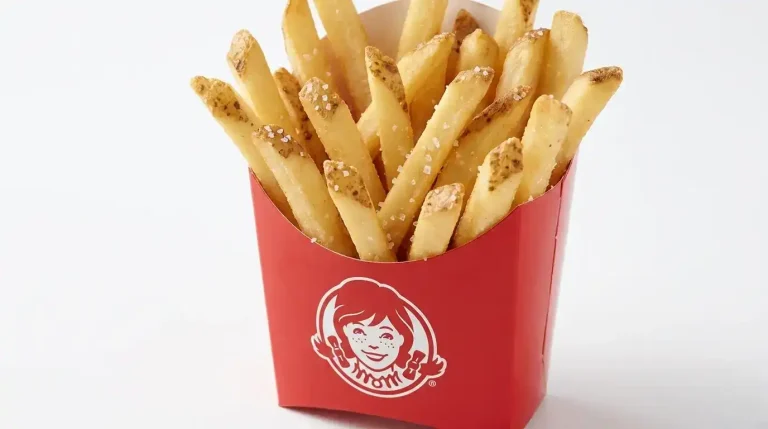 Wendy's Sides Menu: Full List, Prices, and Calories (2026) 2 Wendy's Natural-Cut Fries in a small red carton